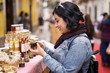 © Per Swantesson/Stocksy - Happy customer shopping at a market