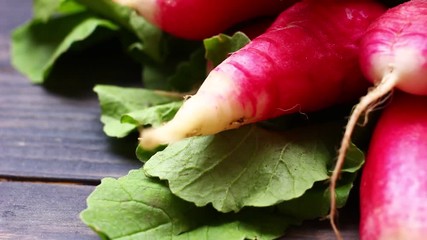 Wall Mural - A bunch of radishes on a wooden background