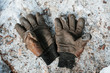 © Justin Mullet/Stocksy - An old pair of worn out work gloves.
