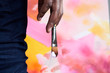 © Ivan Gener/Stocksy - Back view of painter holding brush with right hand.