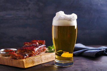 Wall Mural - Beer and pork spare ribs. Beer and meat. Glass of ale