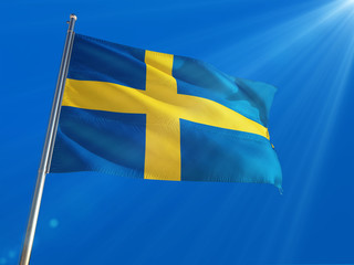 Wall Mural - Sweden National Flag Waving on pole against deep blue sky background. High Definition