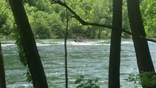 Boat Traveling Up Stream In A Strong River Current