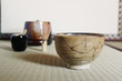 Kintsugi a repair of crack pottery tea cup  at Japanese tea room blur background