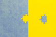 Abstract background of many puzzles on an yellow background. The concept of teamwork.