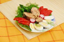 Plate With Sardines Tomatoes And Aromatic Herbs On A Table