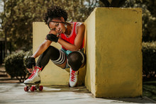 Beautiful Black Woman Posing On Roller Skates