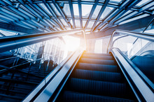 Escalator Of Modern Office Building, Blue Toned Images.