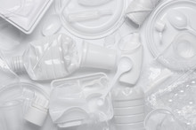 Plastic Waste. Single-use Plastic Objects, Ecological Pollution. White Packaging Plastic Products, Top View Flat Lay.