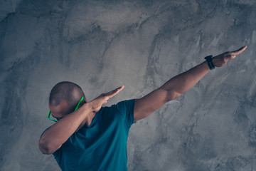 Wall Mural - Close up photo amazing stunning he him his dark skin macho hot modern look trend motion hands arms raised strange dancing action clubber wear specs casual blue t-shirt isolated grey background