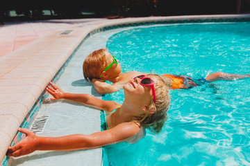 Poster - little boy and girl relax in pool, family on beach resort