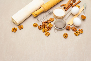 Raw ingredients for walnut pie. Baking concept cooking on stone background, copy space.