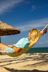 Canvas Print - Woman on a hammock at the beach