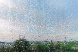 Fototapeta Łazienka - Rain outside window raindrops on windowpane in summer day