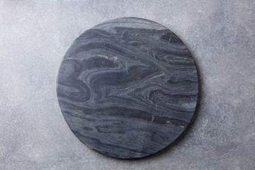 Wall Mural - Black marble texture board on grey background. Top view. Copy space.