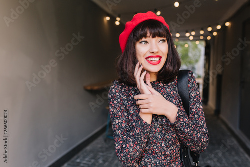 Animated Brunette Girl In Red Beret And Vintage Dress Rubs Her