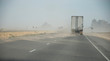 Truck in sandstorm in desert USA