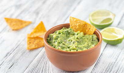 Poster - Bowl of guacamole with tortilla chips