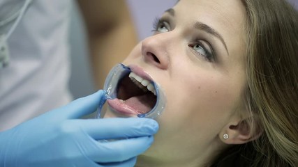 Sticker - Pretty woman's teeth treatment in dental clinic