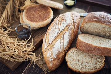 Fresh Bread On Wooden Table.