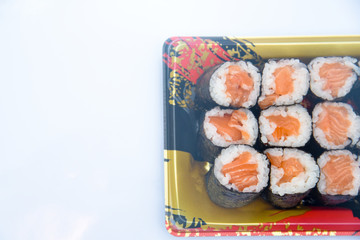 Wall Mural - Sushi Roll with salmon on the white background .Food abstract background