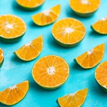 Oranges On Blue Background. Flat Lay Composition. Close Up.