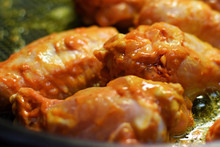 Cooking Hot Chicken Wings In Frying Pan. Close Up Image With Shallow Depth Of Field.