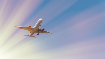 Passenger airplane in blue sky. Commercial plane is landing. Fast Travel and transportation concept. At sunset