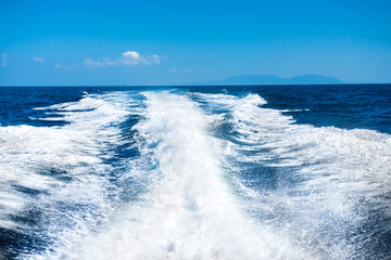 Wake of boat on water surface