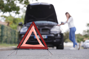 Wall Mural - problems car and red triangle on the road