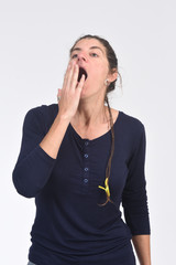 Wall Mural - woman yawning on white background