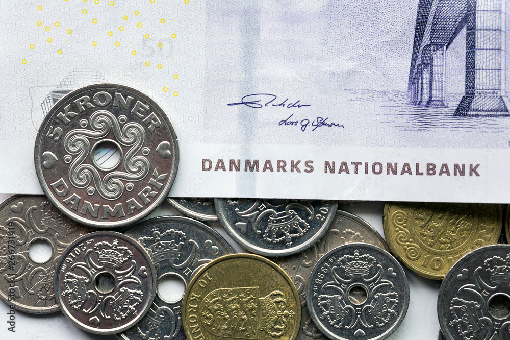 Mixed Danish coins over a Danish fifty Kroner banknote - Kroner is the ...