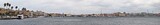 Fototapeta Nowy Jork - Panoramic view of Taranto, Puglia, Italy, old town with steel plant, cover of mining parks and petrochemical industry immediately behind, sunset on the sea