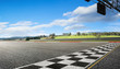 Wide angle view empty asphalt international race track with start and finish line , morning scene .