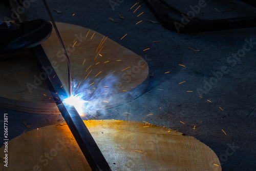 Close Up View Strong Man Is A Welder In Blue Working Overalls