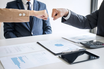 Aufkleber - Teamwork of businessman partnership giving fist bump to greeting start up business strategy project