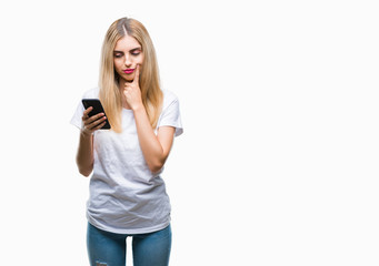 Sticker - Young beautiful blonde woman using smartphone over isolated background serious face thinking about question, very confused idea