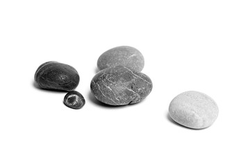 Wall Mural - Scattered sea pebbles. Heap of smooth gray and black stones isolated on white background