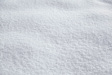 Natural snowy texture, winter background. Frosty weather with loose snow surface in wintertime