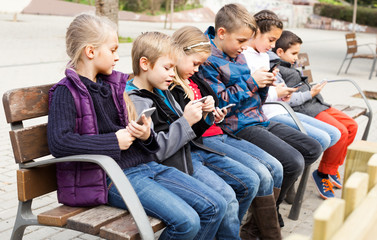 Wall Mural - children with mobile devices