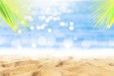Fototapeta Morze - Tropical nature clean beach and white sand in summer with sun light blue sky and bokeh background.