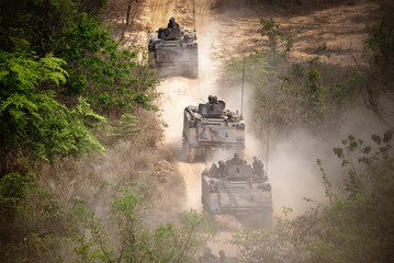 Wall Mural - Backside of  Soldier army operation, Grunge style image of modern armored tanks in battle