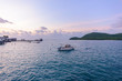 © sirastock - Sattahip harbor view in the morning and boat tourists
