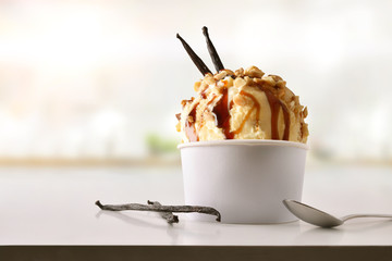 Vanilla ice cream cup on white table homemade in kitchen