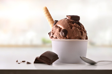 Chocolate ice cream cup on white table homemade in kitchen