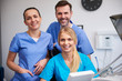 © gpointstudio - Team of happy stomatologists in dentist's clinic