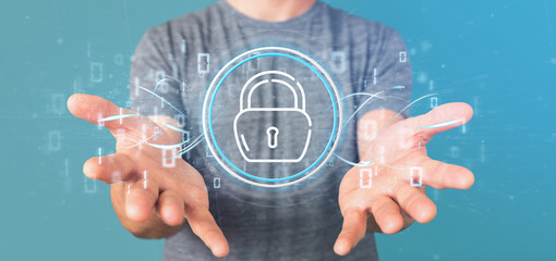 businessman holding security padlock wheel icon with stats and binary code 3d rendering