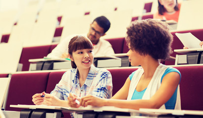 Poster - education, high school, university, learning and people concept - group of international students talking in lecture hall