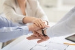 © Syda Productions - business, gesture and teamwork concept - close up of businesspeople or architects stacking hands