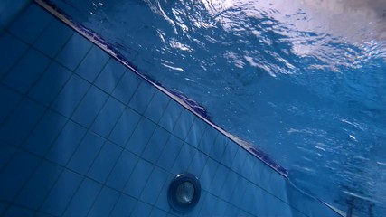 Wall Mural - underwater view of swimmer starts from the side of the pool